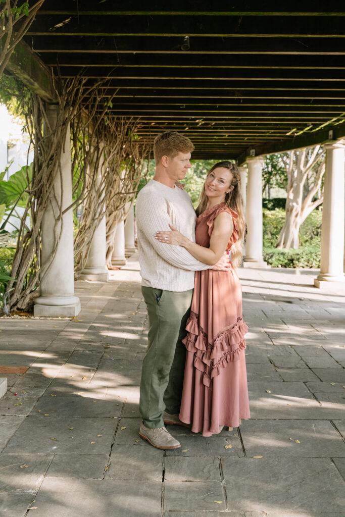 Couple embracing at the Dallas Arboretum and Botanical Garden, a romantic location for an intimate elopement in Dallas Texas