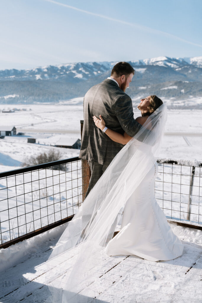 Bride and groom sharing a first look during a snowy Grand Teton National Park elopement in Wyoming